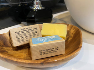 3 bars of Kinder by Nature Palm Oil-Free Shea Butter Baby Soap, all in a wooden bowl